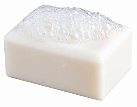 A clean soap bar with water droplets on its surface positioned on a white background to emphasize freshness and hygiene isolate on transparent background