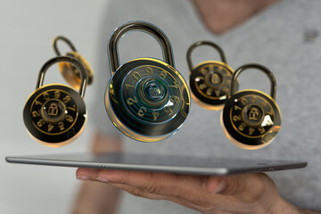 Secure your data.  Image of combination locks hovering above tablet, symbolizing digital security...