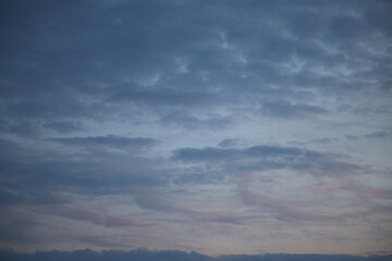 Clouds illuminated from below by sunset light create an impression of unreality. Such an image is suitable for fairy tale or magical illustrations.