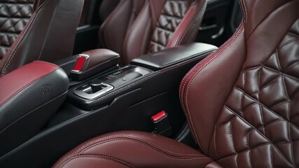 Luxurious red leather car seat with diamond stitching pattern, symbolizing comfort, high-end design, automotive interior, and premium lifestyle