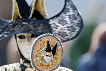 Woman wearing traditional mask and costume.   Annual venetian carnival of Annecy, Haute Savoie,...