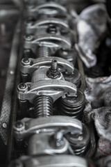 Vehicle overhead camshaft engine exposed for repair and maintenance services at auto repair shop