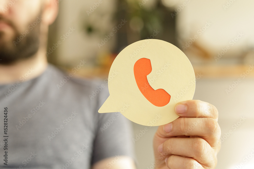 Poster image of a man holding a paper speech bubble with a phone icon, ideal for contact us pages and custo