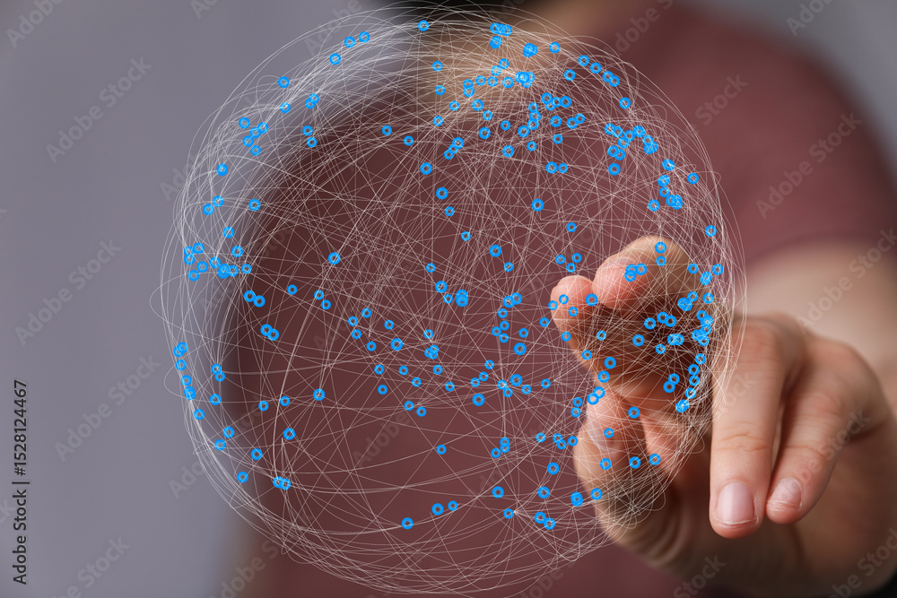 Aufkleber Abstract image of a hand interacting with a digital sphere representing global network connections.