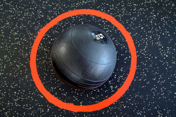 Fitness room. Medicine ball for excercise. 5 kilos. Health club.