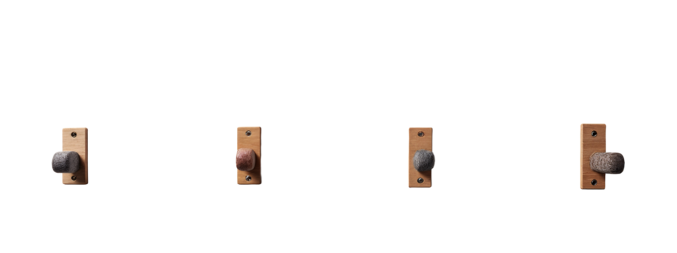 A set of four wooden hooks with a stone on them.