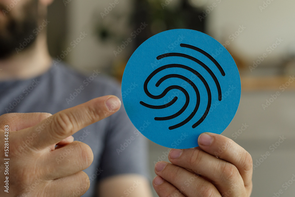 Aufkleber stock photo of a man pointing at a fingerprint icon on a blue circle. perfect for security, privacy,