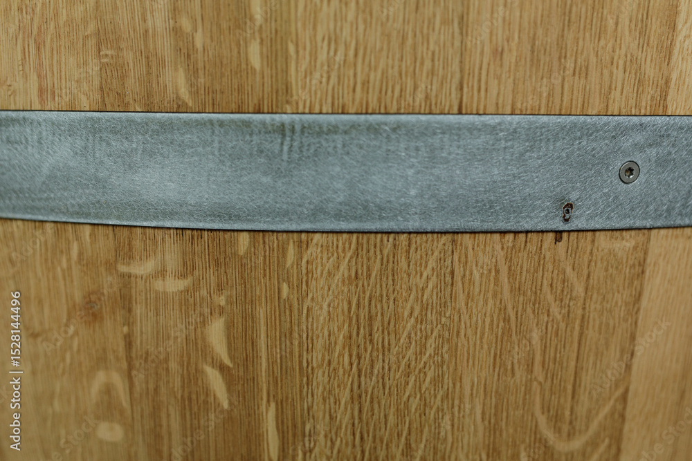 Poster high-resolution image of a wooden barrel's texture, featuring a metal band. ideal for rustic backgro