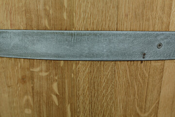 Close-up of oak barrel texture, metal band detail.  Perfect for rustic, vintage, or industrial designs.