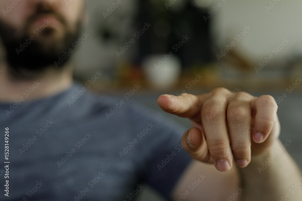 Poster Close-up image of a man's hand pointing.  Perfect for concepts of direction, choice, or guidance.