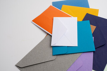 Paper envelopes on a light background. New mail, write a message. Send and receive mail. Postal delivery service. Empty envelope, empty space. Communication with people, paperwork. Envelope close-up