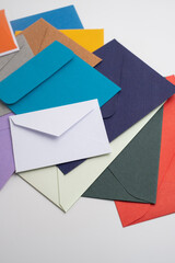 Paper envelopes on a light background. New mail, write a message. Send and receive mail. Postal delivery service. Empty envelope, empty space. Communication with people, paperwork. Envelope close-up
