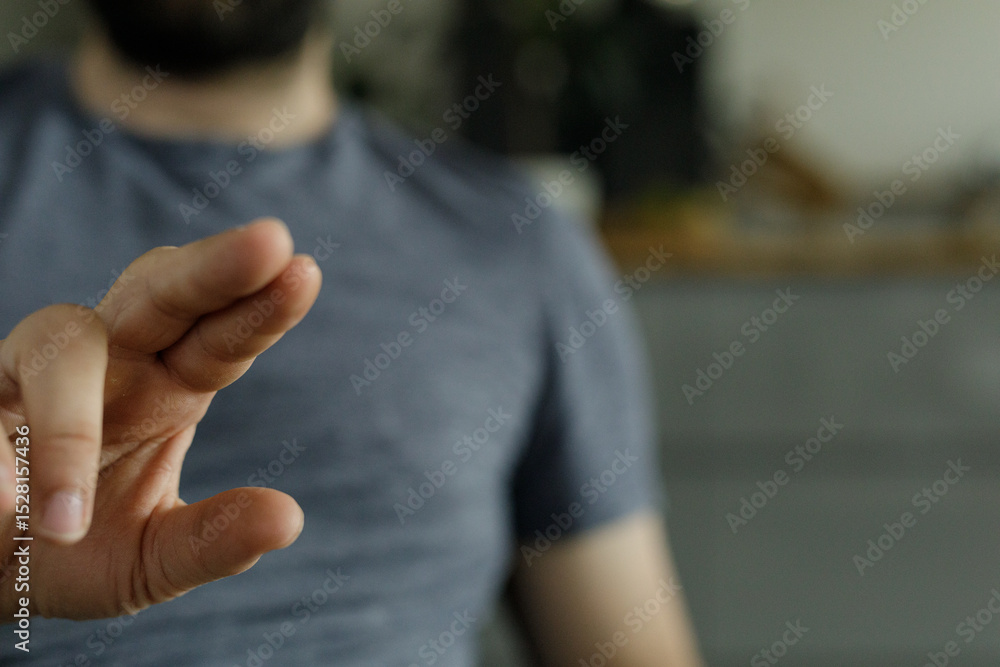 Poster close-up image of a man's hand gesturing. perfect for technology, communication, or interaction conc