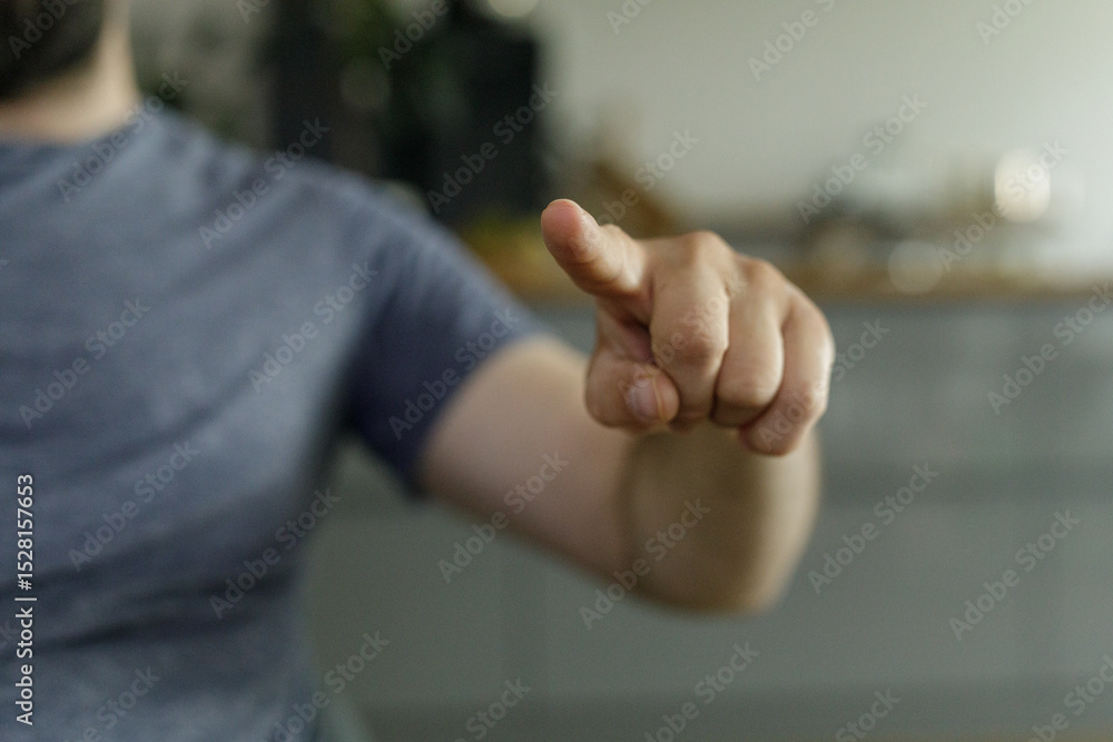 Poster close-up of a man's hand pointing. perfect for concepts of direction, choice, selection.