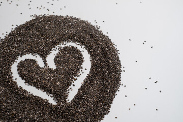 Chia heart on white background, space for text. Superfood.