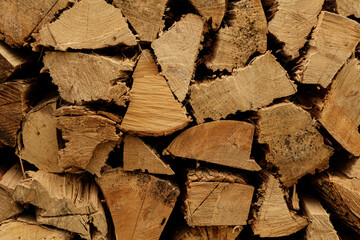Close-up of neatly stacked firewood, perfect for autumn or winter themes.  Ideal for blogs,...