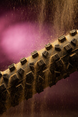 Mountain Bike tire with dirt in studio