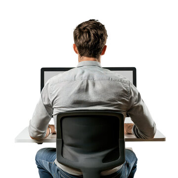 Man sitting at white desk in front of a laptop computer from behind, wearing jeans and a button-down shirt