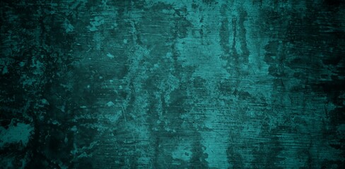 A textured background featuring a deep teal color with a distressed, grunge appearance. The surface shows variations in tone and subtle patterns, creating an abstract and moody aesthetic.