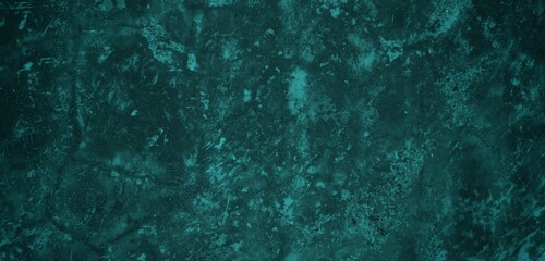 A textured background featuring a deep teal color with a distressed, grunge appearance. The surface shows variations in tone and subtle patterns, creating an abstract and moody aesthetic.