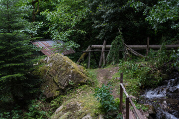 A water chute leading to a watermill in the forest, Georgia