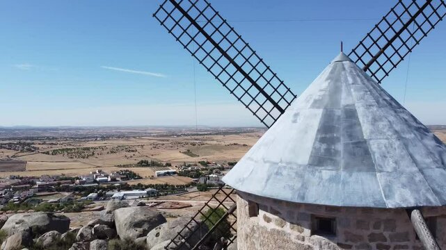 Ascending Camera Movement with Windmill in the Foreground in Las Ventas with Pe&ntilde;a Aguilera, La Mancha - 683