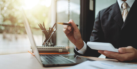Accountant working with computer tablet in modern office, preparing accounting analysis report,...