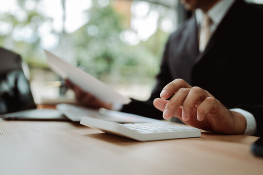 Financial professionals are calculating personal taxes for their clients.