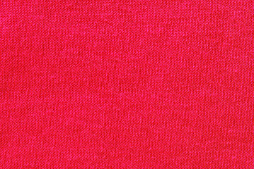 Jersey fabric texture, a surface of pink color jersey fabric texture as background