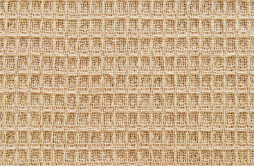 Brown cotton waffle fabric texture as background