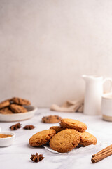 Homemade peanut or almond butter cookies or oatmeal cookies on white kitchen background. High quality photo