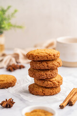 Homemade peanut or almond butter cookies or oatmeal cookies on white kitchen background. High quality photo