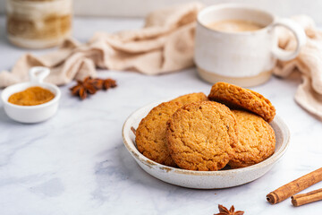 Homemade peanut or almond butter cookies or oatmeal cookies on white kitchen background. High quality photo