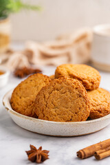 Homemade peanut or almond butter cookies or oatmeal cookies on white kitchen background. High quality photo