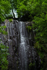 Small mountain waterfall in the forest, Georgia, relief rocks