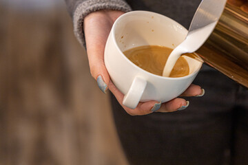 Barista coffee service concept.Barista women using coffee machine to make coffee in cafe