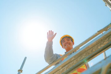 Smiling Asian Construction Worker Waving Scaffold Bright Blue Sky Morning