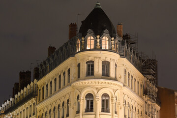 Old Lyon building illuminated at dusk