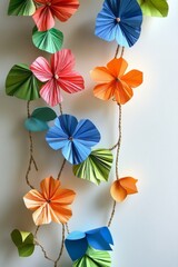 Obraz premium Vibrant handmade paper flowers strung together, adding a touch of cheerful decoration