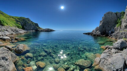 Crystal-clear coastal cove, rugged cliffs, brilliant blue sky