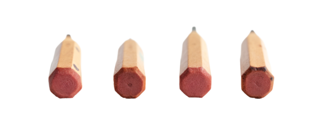 A group of three pencils are lined up in a row.