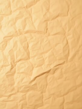 Close up view of crumpled brown paper showcasing recycled craft paper texture as background Set 7