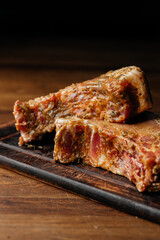 Raw Marinated Pork Ribs on Rustic Cutting Board