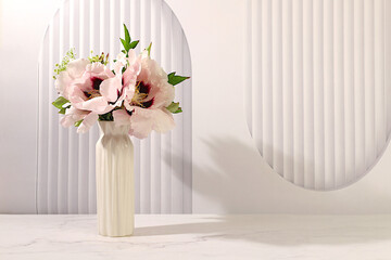Still life with spring flowers mountain peony in vase on elegant modern table,template for your design with space for text,minimal beauty concept,beautiful flower card,abstract flower arrangement.