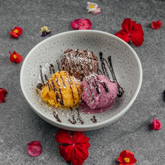Trio of Colorful Ice Cream Scoops with Chocolate Drizzle