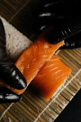 Sushi Chef Rolling Fresh Salmon Sushi © Chenkaliuk Bogdan