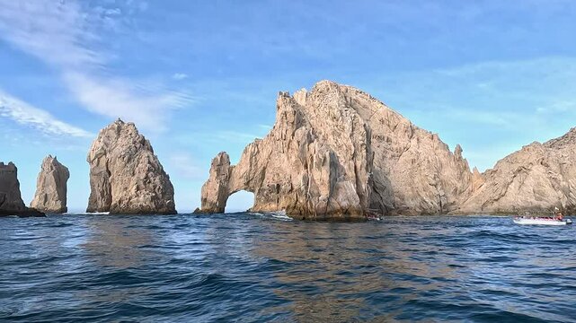 Cabo San Lucas Mexico lands end arch from boat. Resort city at southern tip of the Baja California peninsula. Beach eco tourism economy. Commercial seaport. Ocean destination vacation and business.