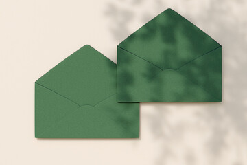 Paper envelopes on white surface with shadow patterns. 3d rendering