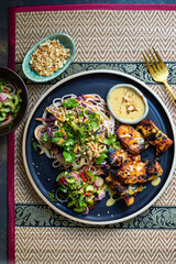 Chickem thighs, satay sauce, noodles and cucumber salad
