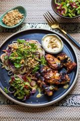 Chickem thighs, satay sauce, noodles and cucumber salad